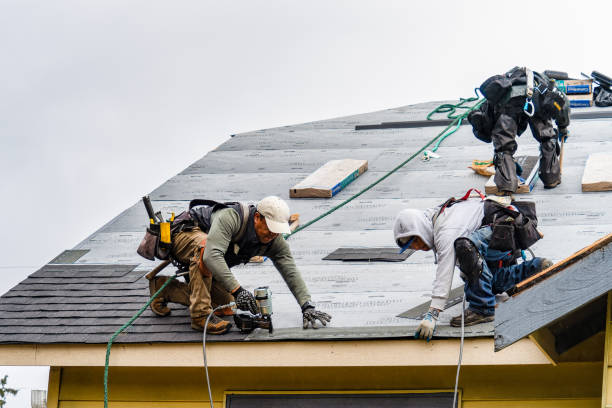 Professional Roofing technician working in Oakham, MA